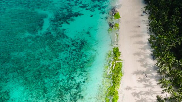 Puka Shell Beach. Clear turquoise water and ocean waves on sand. Boracay, Philippines.
