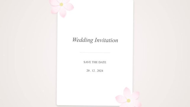 Elegant Wedding Invitation Card with Floral Accents and Soft Pink Background.