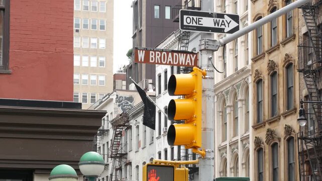 New York West Broadway street sign in Lower Manhattan, United States. Urban road sign in american city, traffic sign in NYC. Architecture of Tribeca district. Subway entrance green globe, orb lamp.
