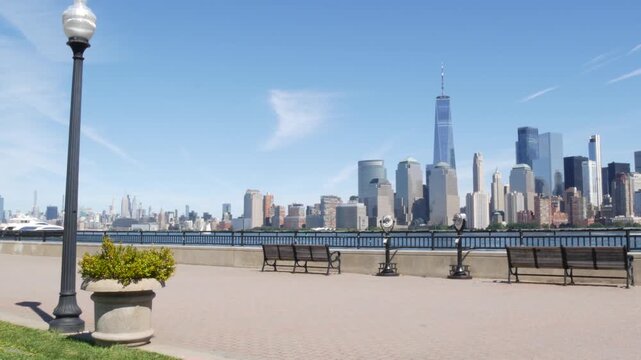 New York City Manhattan Downtown Financial District skyline, World Trade Center tower, cityscape from New Jersey Liberty state park, United States. Hudson river waterfront walkway, skyscraper building