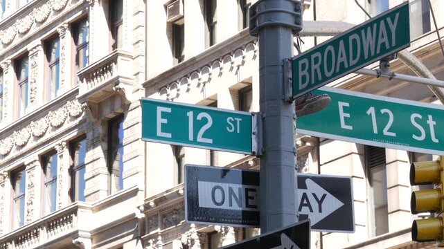 New York City Broadway street sign on Manhattan, United States. Urban road sign in american city. Traffic sign in Midtown of NYC, USA. Building architecture in residential district near Union Square.