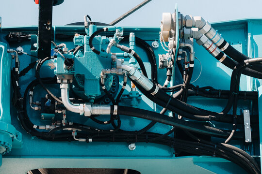 Hydraulic crane engine.The control system of the crane engine.Lifting hydraulic Department on the truck crane.The hydraulic system of the engine.hydraulic hoses on the crane.autoparts