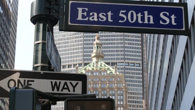 New York Park Avenue, 50 street sign in Manhattan Midtown, United States. Urban road sign in american city, traffic sign in NYC, USA. Building architecture near Grand Central. One way arrow.