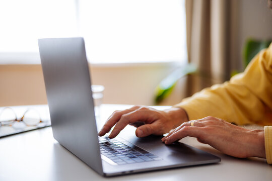 Working From Home On Laptop With Hands Typing