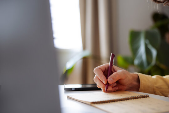 Person Writing Notes