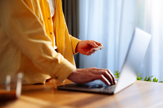 Person Making Online Payment With Credit Card 
