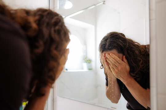 Man Washing His Face 