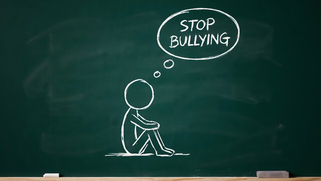 Chalk drawing of a sad child thinking about stopping bullying on a blackboard