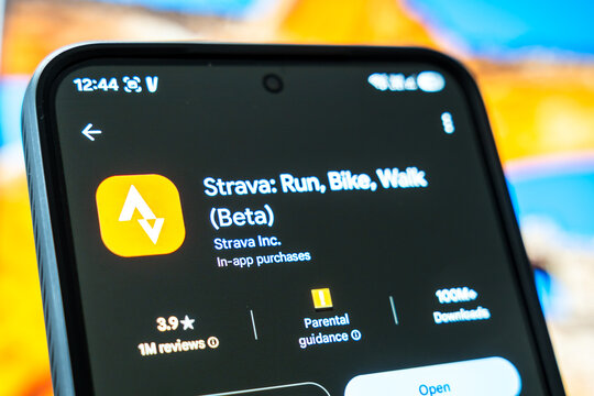 Warsaw, Poland - July 6, 2026: Close-up of Strava app showcasing running, biking, and walking features on smartphone screen, highlighting fitness tracking and activity monitoring technology in modern
