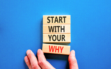 Obraz premium Start with your why words symbol. Concept words Start with your why on beautiful wooden blocks. Beautiful blue background. Businessman hand. Business start with your why concept. Copy space.