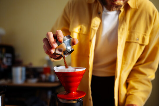 Man Preparing Pour-Over Coffee in Home Kitchen