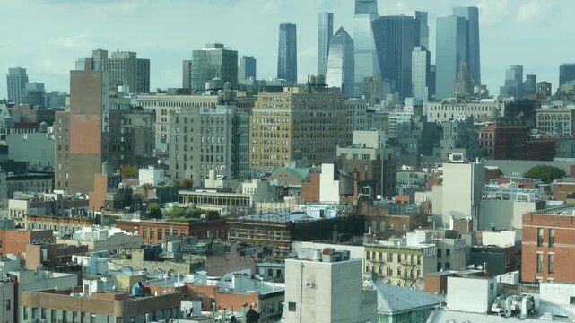 New York City Manhattan Midtown cityscape, Hudson Yards from rooftop on Bowery street, United States of America. Buildings architecture, water tower tanks on roof. Aerial view of residential district.