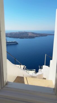 White architecture in Santorini island, Greece. Blue sea and the blue sky at sunny day. Luxury resort. Travel and summer vacation concept. Vertical video

