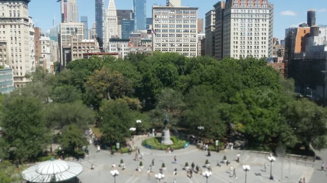 New York City Manhattan Midtown Union Square on Broadway street, United States of America. Old historic building urban architecture from above. Cityscape skyline and summer greenery in park. People.
