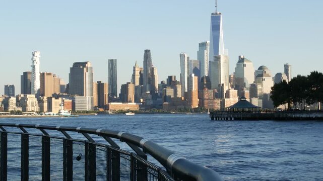 New York City Manhattan Downtown Financial District skyline, World Trade Center tower from New Jersey, Hoboken pier, United States of America. River waterfront urban cityscape with skyscraper building