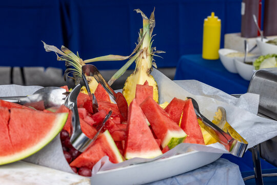 Platter of cut fruit like Watermelon and Pineapple at a Catered Corporate BBQ Event