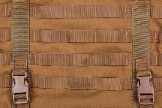 Brown tactical backpack molle webbing details