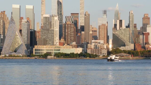 New York City Manhattan Midtown skyline, Hells kitchen from New Jersey, Weehawken Port Imperial, United States. Urban cityscape with skyscraper building, American architecture. Hudson River waterfront