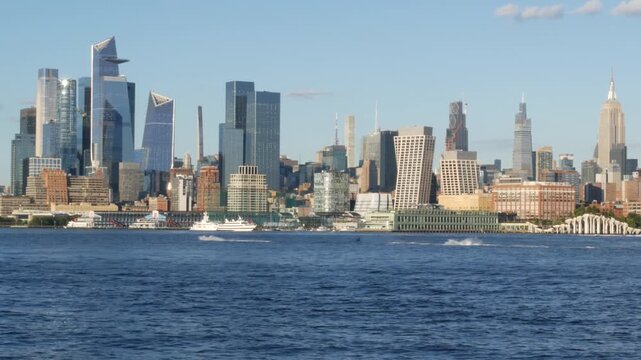 New York City Manhattan Midtown skyline, Chelsea and Hudson Yards towers from New Jersey, Hoboken pier, United States. River waterfront urban cityscape with skyscraper buildings, American architecture