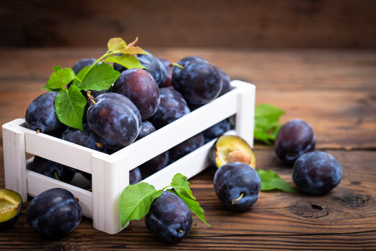 Fresh organic plums in the crate	