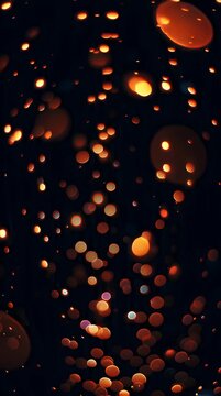 Glowing orange bokeh light spots.