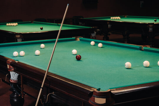 Billiard table with green surface and balls in the billiard club.Pool Game