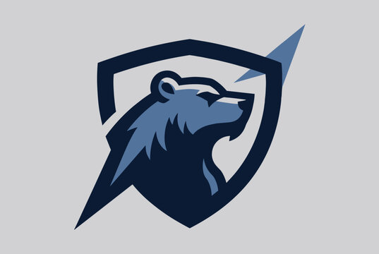 Powerful sports team mascot logo displaying a strong blue bear head inside a protective crest shield frame.