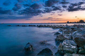 Fototapeta premium Blue Hour Sunset over Rocky Mediterranean Coastline, Limassol, Cyprus
