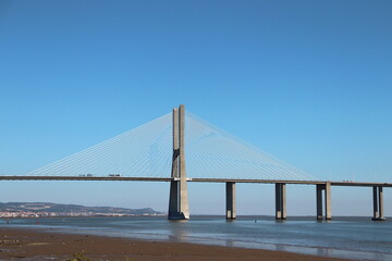 Obraz premium Vasco da Gama Bridge over Tagus River – Modern Cable‑Stayed Architecture in Lisbon
