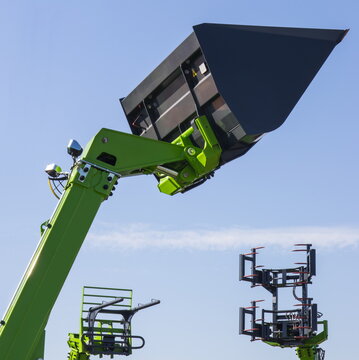 Excavator shovel and loader machine for transport bales of straw. Part of industrial and agricultural machine