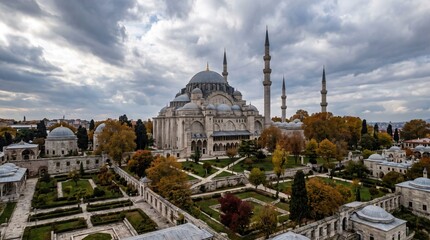 Naklejka premium Grand Ottoman Mosque Dome Minarets Autumn Gardens Aerial