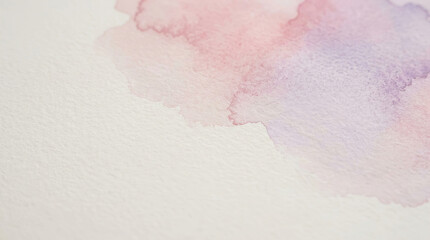 Fototapeta premium Soft pastel watercolor wash blending pink and purple hues on textured white paper background