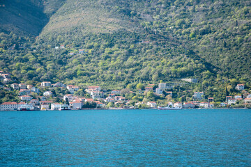 Fototapeta premium Ferry service in Montenegro, connecting Kameniari and Lepetane across the scenic Verige strait.