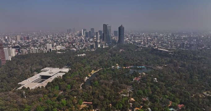 Mexico City Aerial v83 drone flyover chapultepec park towards metropolitan area capturing downtown cityscape across anzures and colonia cuauhtemoc neighborhoods - Shot with Mavic 3 Cine - January 2022