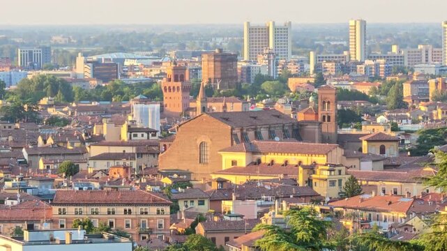 Bologna cityscape showcasing the historic downtown with its ancient buildings, prominent churches, and the iconic Asinelli and Garisenda towers rising above the medieval rooftops in Italy