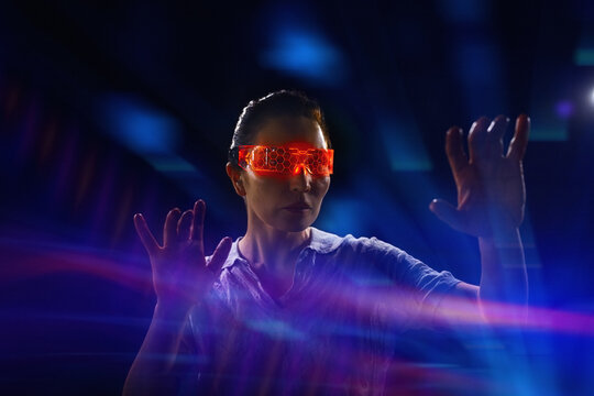 Woman experiencing virtual reality with neon elements