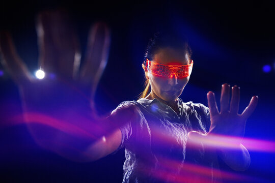 Futuristic woman immersed in neon-lit cyberspace