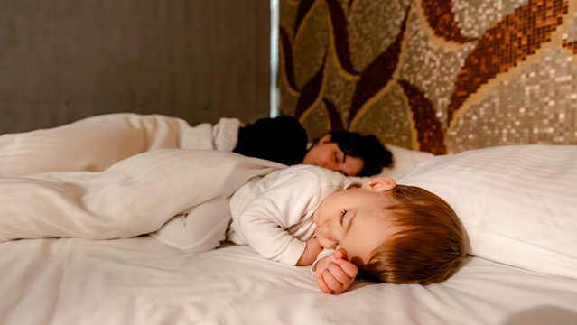 Peaceful sleep of a baby and mother in Taipei hotel