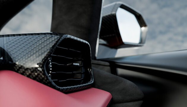 Close-up of luxury car interior with carbon fiber vent