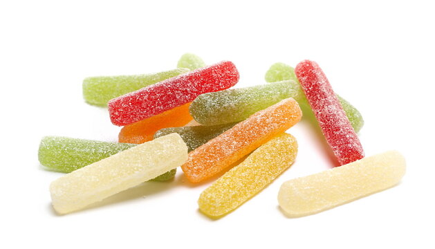 Colorful jelly fruit candies, candy pile isolated on white background, side view