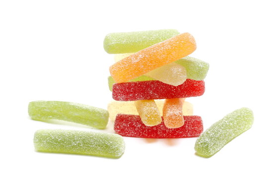 Colorful jelly fruit candies, candy pile isolated on white background, side view