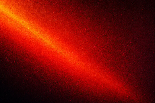 Dark red background with intense glowing light beam, creating dramatic and energetic effect.