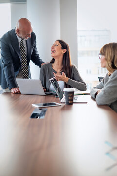 Business colleagues discussing ideas in modern office