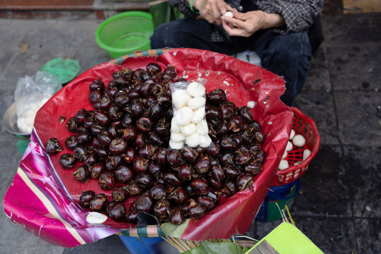 Street vendor selling water chestnuts in Hanoi