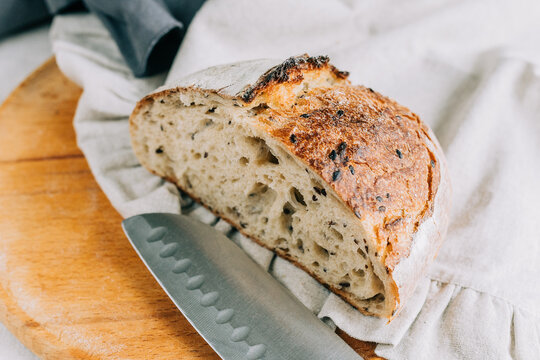 Rustic artisan bread with organic ingredients, homemade slice