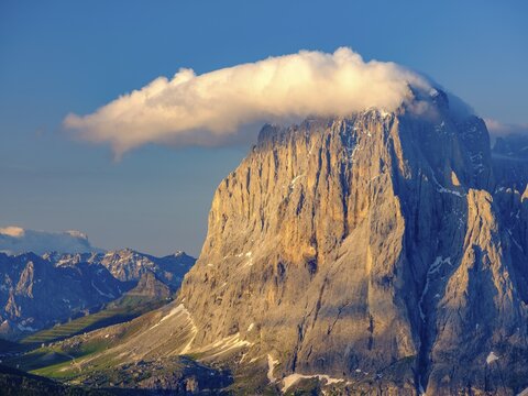 Sassolungo with clouds, behind the Pala, Dolomites, South Tyrol, Italy