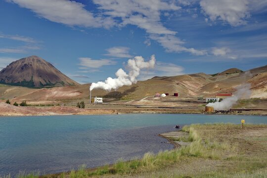 Volcanic mountains, lake with surreal colour, smoking chimneys, pebble gabik near Myvatn, Iceland