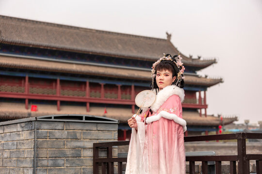 Male in hanfu at Xi'an City Wall by ancient gate