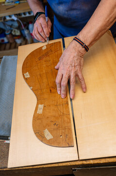 Crafting a guitar in a workshop with skill and precision