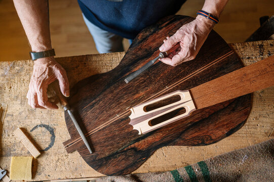 Crafting a guitar in a workshop in Spain during retirement